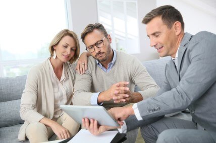 Financial adviser showing terms of contract on tablet Financial adviser showing terms of contract on tablet